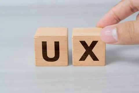 UX development, User Experience design concept, hand building cube wooden b.. Stock Photos