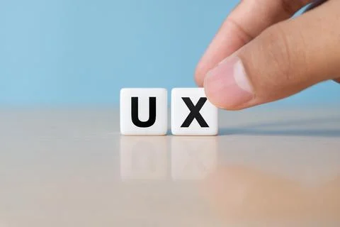 UX development, User Experience design concept, hand building dice with alp.. Stock Photos