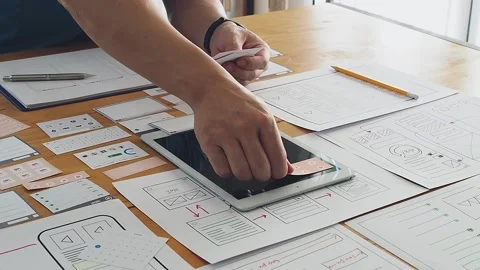 UX or UI designer designing application on tablet with mockup layout prototype. Stock Footage 145669791