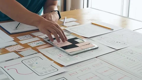 UX or UI designer designing application on tablet with mockup layout prototype. Stock Footage 157527027