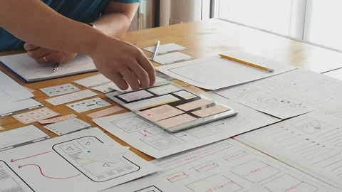 UX or UI designer designing application on tablet with mockup layout prototype. Stock Footage 166351860