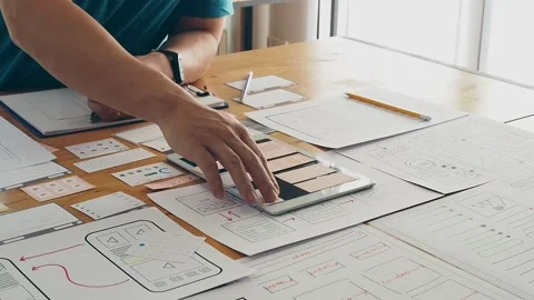 UX or UI designer designing application on tablet with mockup layout prototype. Stock Footage 172442520