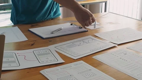 UX or UI designers preparing mockup layout prototype before meeting. Stock Footage 242904090