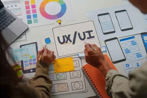 UX UI Design Process. Team members sketching app layouts and features. Stock Photos