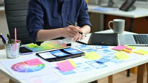 UX UI designer drawing app wireframe with pencil and color palette. Creativ.. Stock Footage 312437763