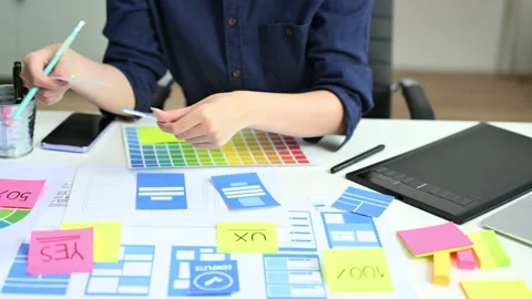 UX UI designer drawing app wireframe with pencil and color palette. Creativ.. Stock-Footage 312437935