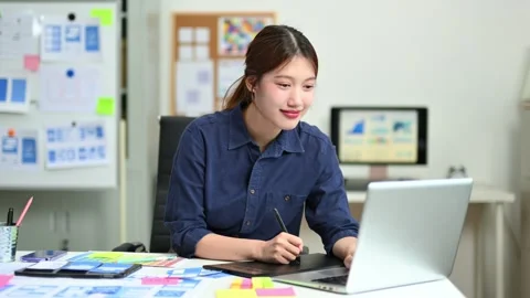 UX UI designer planning mobile layout with sticky notes in modern office. C.. Stock Footage 312437679