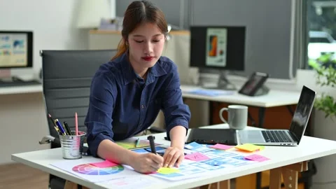 UX UI designer planning mobile layout with sticky notes in modern office. C.. Stock Footage 312437702