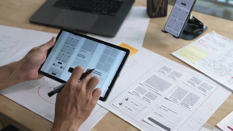 UX UI designer working on wireframes for a website and mobile app prototype Vídeo Stock 337915298