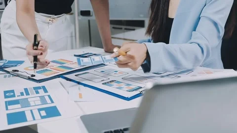 UXUI design brainstorming session with sketches and digital tools Stock Footage 323348627