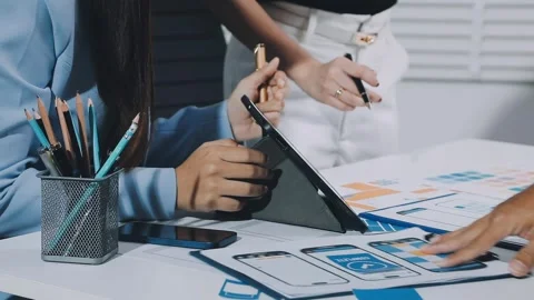 UXUI design brainstorming session with sketches and digital tools Stock Footage 323348635