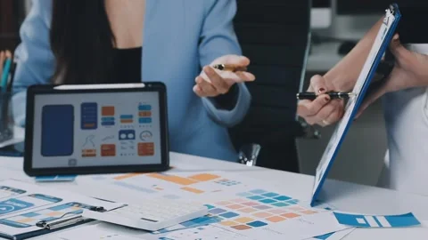 UXUI design brainstorming session with sketches and digital tools Stock Footage 323348636