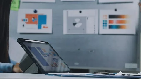 UXUI design brainstorming session with sketches and digital tools Stock Footage 323348647