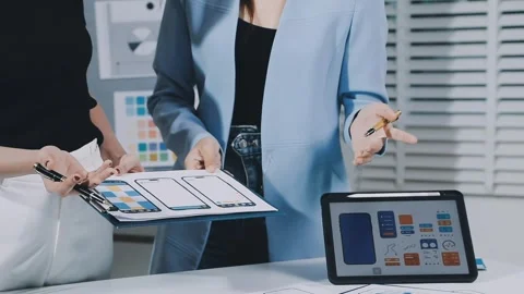 UXUI design brainstorming session with sketches and digital tools Stock Footage 323348673