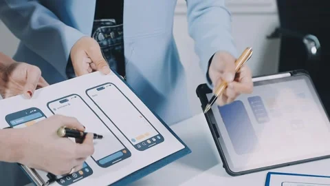 UXUI design brainstorming session with sketches and digital tools Stock Footage 323348694