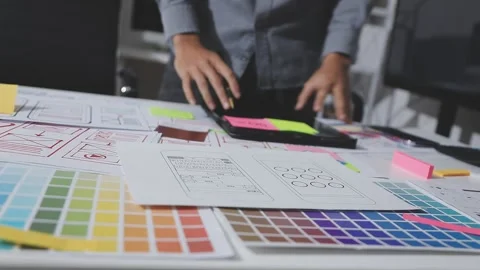 UXUI design brainstorming session with sketches and digital tools Stock Footage 324849053