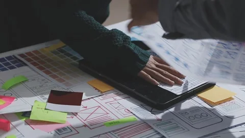 UXUI design brainstorming session with sketches and digital tools Stock Footage 324849210