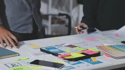 UXUI design brainstorming session with sketches and digital tools 動画素材 324849351