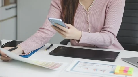 UX/UI designer working on wireframes for a website and mobile app prototype.. Stock Footage 309837141
