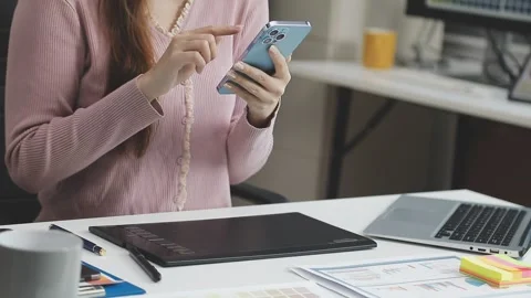 UX/UI designer working on wireframes for a website and mobile app prototype.. Stock Footage 309837150