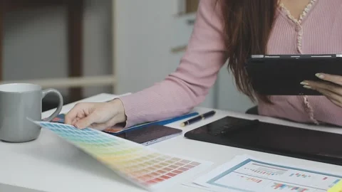UX/UI designer working on wireframes for a website and mobile app prototype.. Stock Footage 309837152