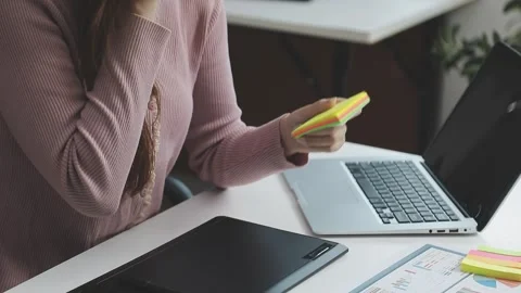 UX/UI designer working on wireframes for a website and mobile app prototype.. Stock Footage 309837157