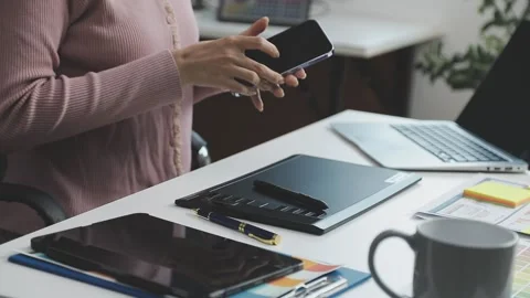 UX/UI designer working on wireframes for a website and mobile app prototype.. Stock Footage 309837201