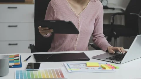 UX/UI designer working on wireframes for a website and mobile app prototype.. Stock Footage 309837216