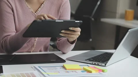 UX/UI designer working on wireframes for a website and mobile app prototype.. Stock Footage 309837229
