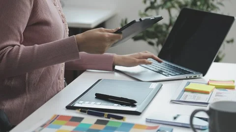UX/UI designer working on wireframes for a website and mobile app prototype.. Stock Footage 309837232