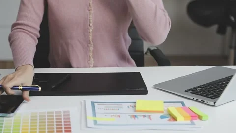 UX/UI designer working on wireframes for a website and mobile app prototype.. Stock Footage 309837247