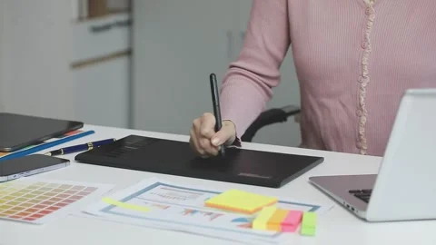 UX/UI designer working on wireframes for a website and mobile app prototype.. Stock Footage 309837257