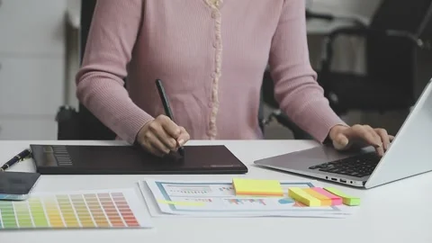 UX/UI designer working on wireframes for a website and mobile app prototype.. Stock Footage 309837265