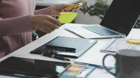 UX/UI designer working on wireframes for a website and mobile app prototype.. Stock Footage 309837274