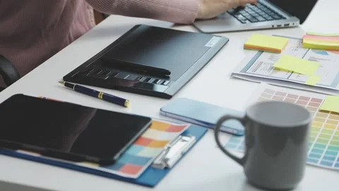 UX/UI designer working on wireframes for a website and mobile app prototype.. Stock Footage 309837275