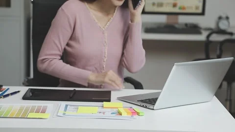 UX/UI designer working on wireframes for a website and mobile app prototype.. Stock Footage 309837286