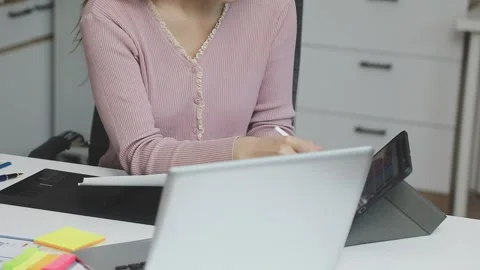 UX/UI designer working on wireframes for a website and mobile app prototype.. Stock Footage 309837289