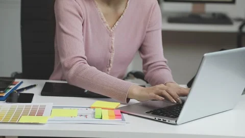 UX/UI designer working on wireframes for a website and mobile app prototype.. Stock Footage 309837298