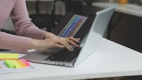 UX/UI designer working on wireframes for a website and mobile app prototype.. Stock Footage 309837311