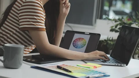 UX/UI designer working on wireframes for a website and mobile app prototype.. Stock Footage 309837332