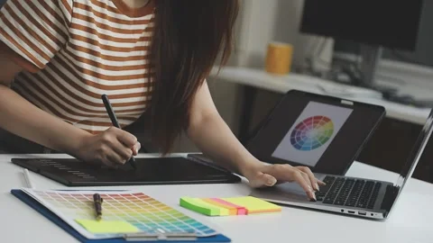 UX/UI designer working on wireframes for a website and mobile app prototype.. Stock Footage 309837334