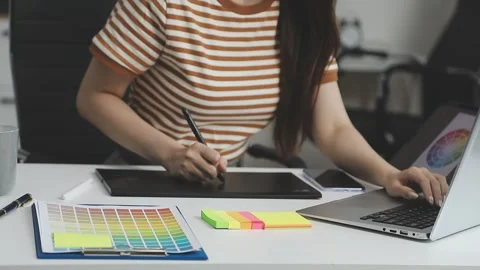 UX/UI designer working on wireframes for a website and mobile app prototype.. Stock Footage 309837336