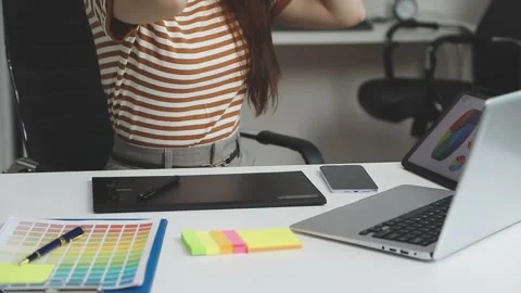 UX/UI designer working on wireframes for a website and mobile app prototype.. Stock Footage 309837341