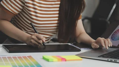 UX/UI designer working on wireframes for a website and mobile app prototype.. Stock Footage 309837344