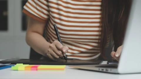 UX/UI designer working on wireframes for a website and mobile app prototype.. Stock Footage 309837351