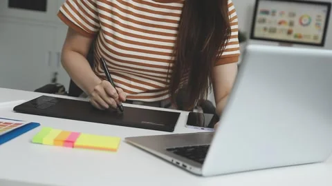 UX/UI designer working on wireframes for a website and mobile app prototype.. Stock Footage 309837353