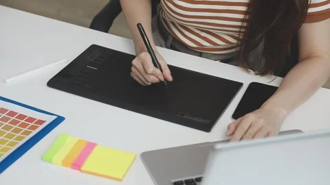 UX/UI designer working on wireframes for a website and mobile app prototype.. Stock Footage 309837354