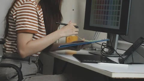 UX/UI designer working on wireframes for a website and mobile app prototype.. Stock Footage 309837391