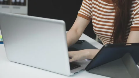 UX/UI designer working on wireframes for a website and mobile app prototype.. Stock Footage 309837410