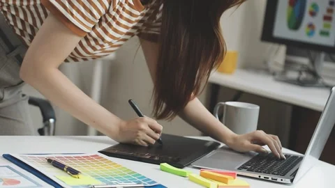 UX/UI designer working on wireframes for a website and mobile app prototype.. Stock Footage 309837452